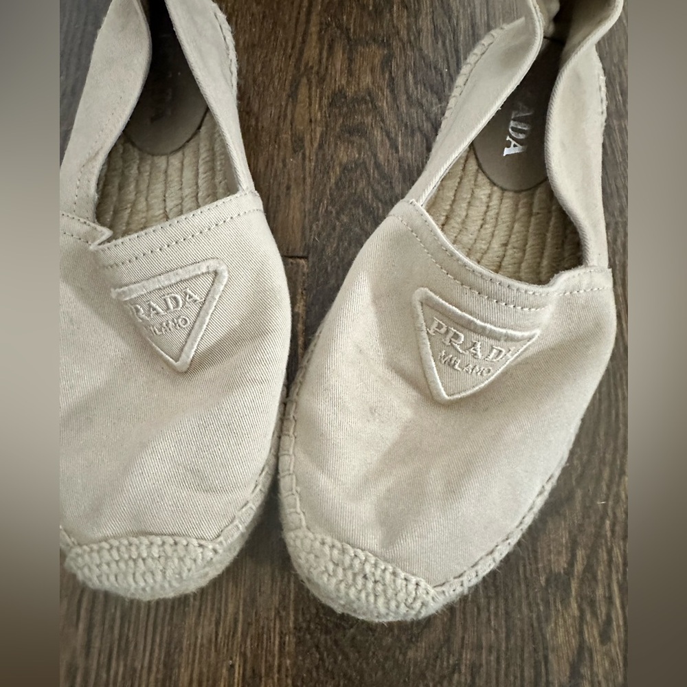 Nude Prada ballet loafers with canvas bottom material